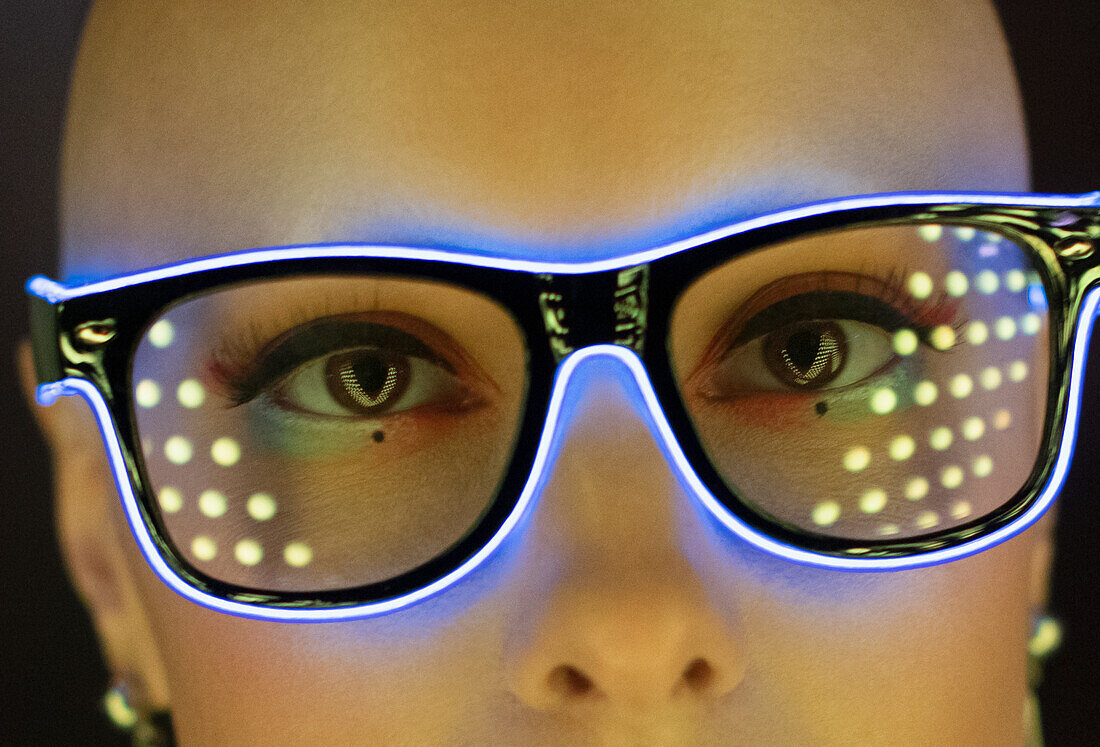 Woman in futuristic neon eyeglasses