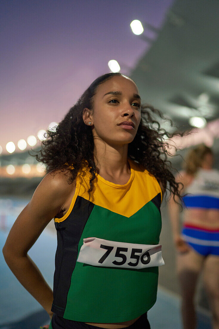 Determined track and field athlete preparing for competition