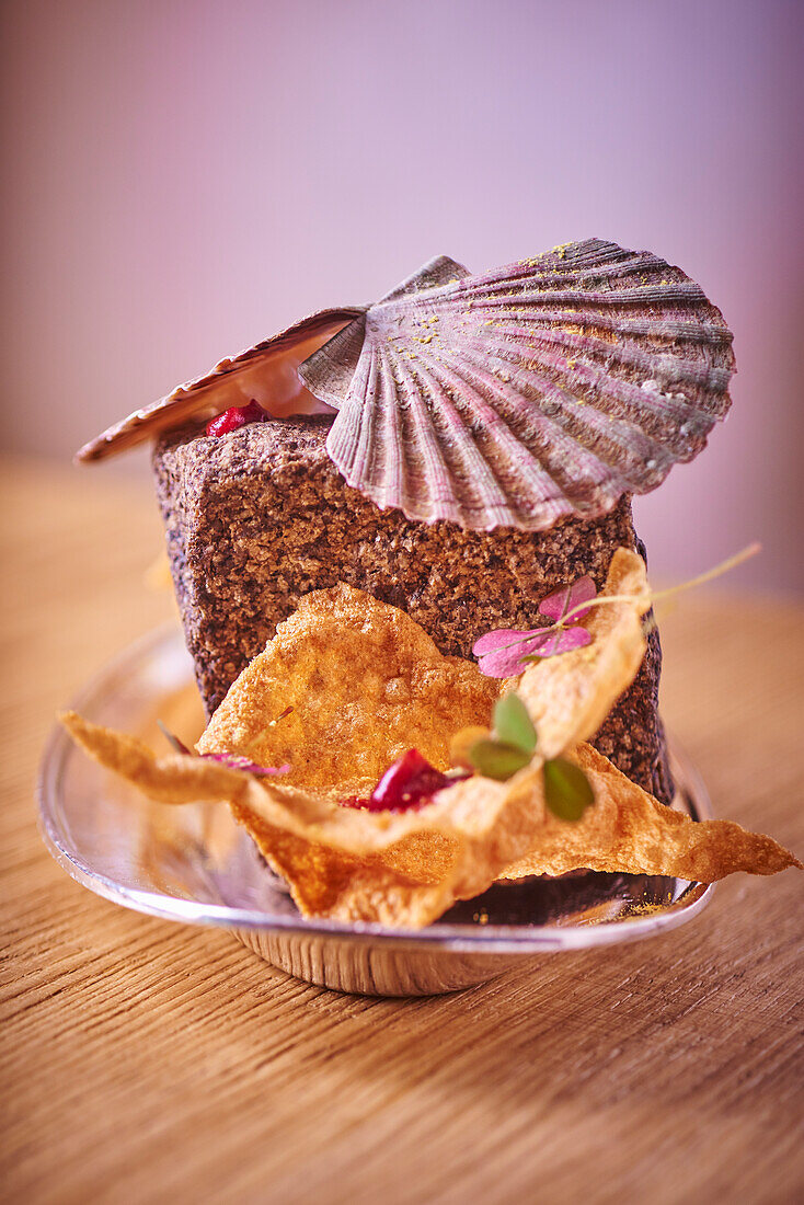 Chips of scallop and scallops on a stone