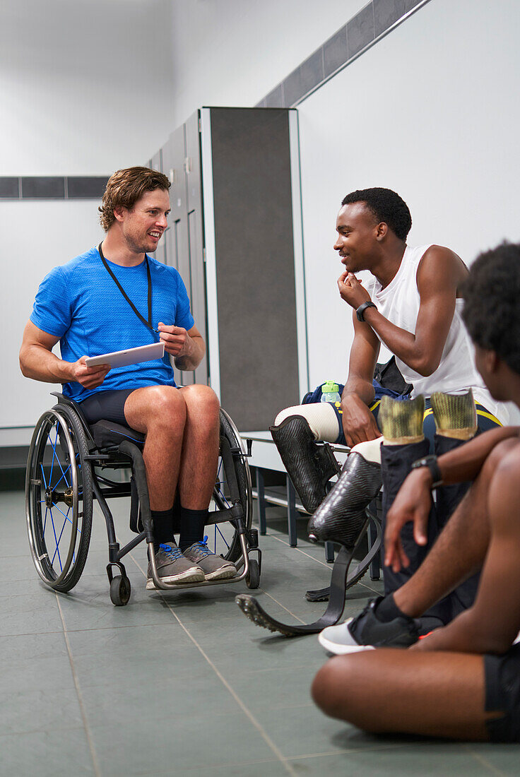 Wheelchair and amputee athletes with digital tablet