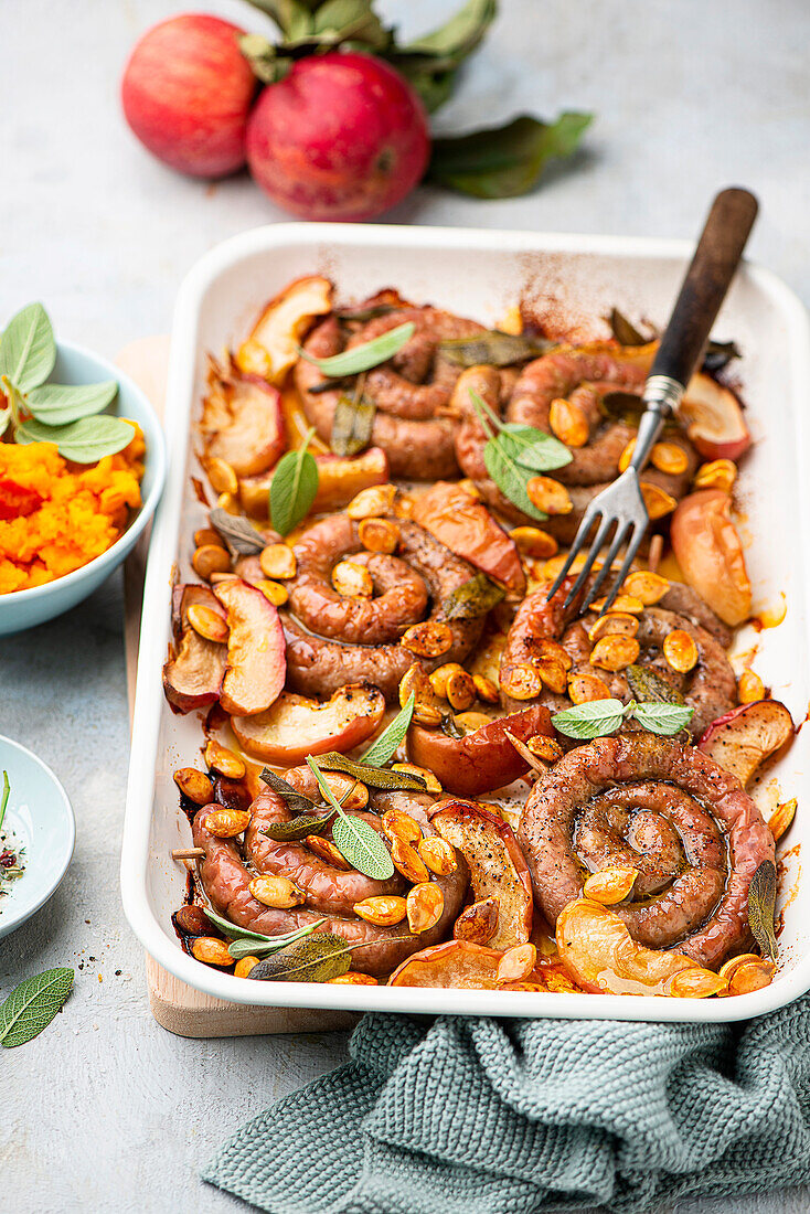 Sausage coils with apples and sage, served with pumpkin puree