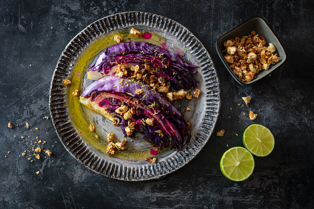 Oven roasted red pointed cabbage with miso, lime dressing and cashew-sesame crunch (vegan)
