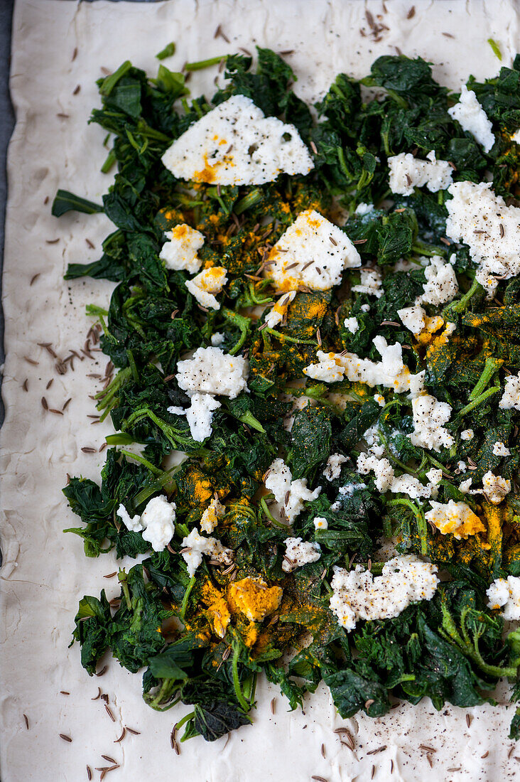 Spinach tart with cheese before going in the oven