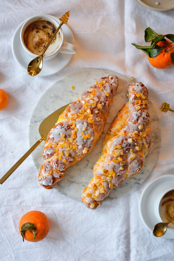 Challah with frosting and orange peel