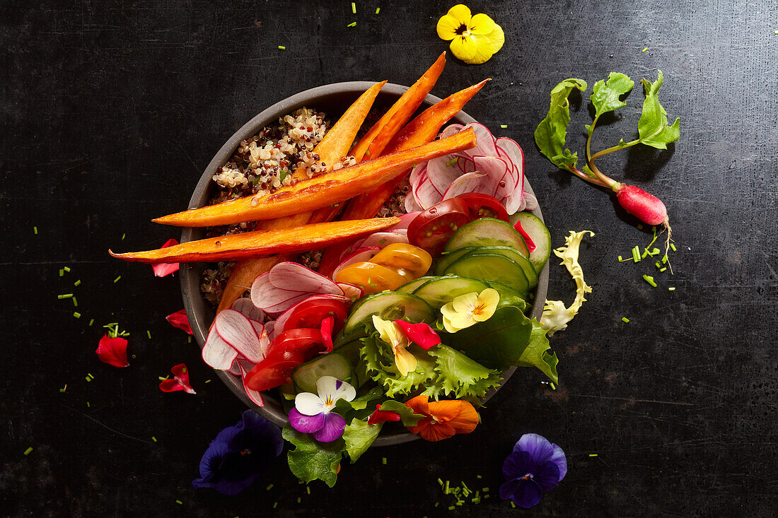 A veggie bowl with edible flowers