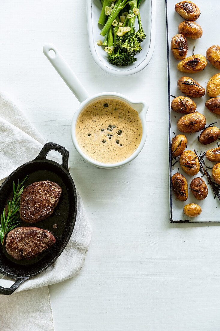 Fillet of beef with pepper sauce, roast potatoes and broccoli