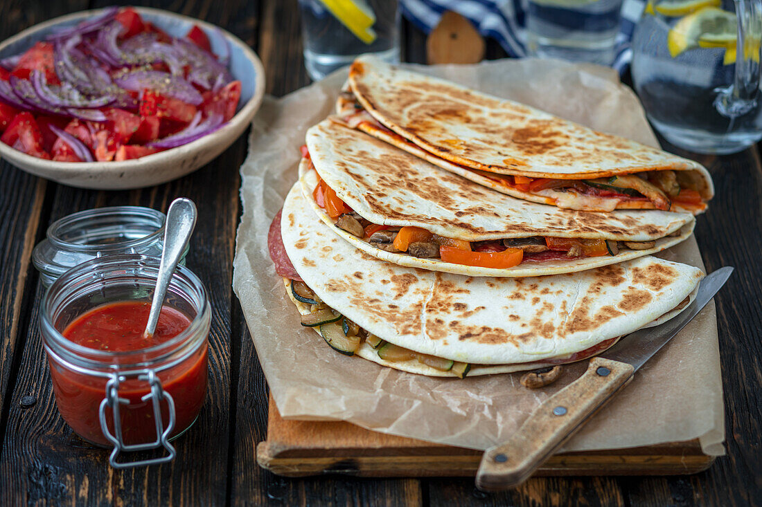 Piada with salami and vegetables