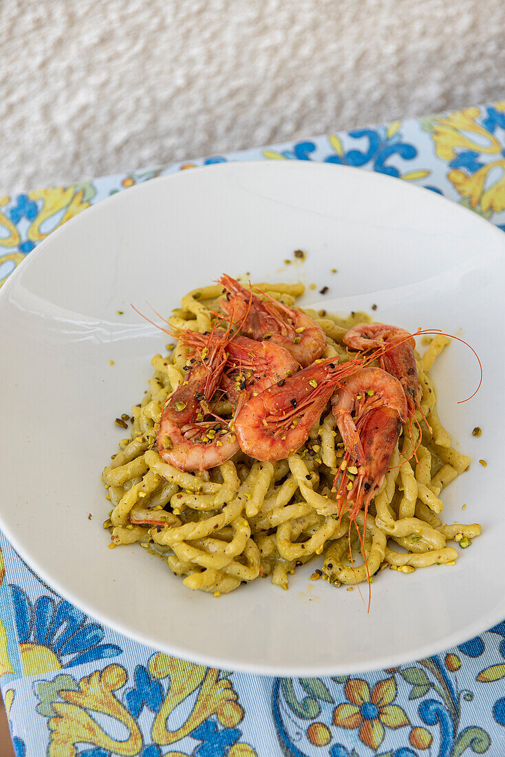 Sicilian handmade busiate pasta with pistachio cream and prawns