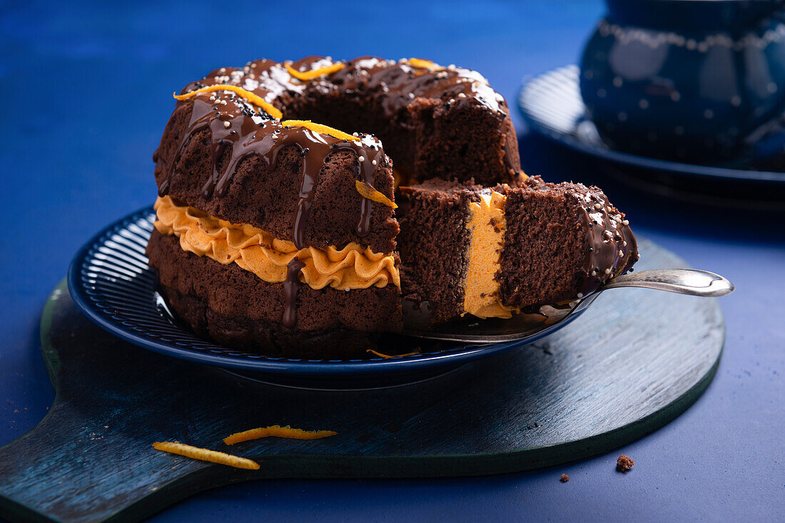 Vegan chocolate sponge cake with pumpkin buttercream filling and plain nougat icing