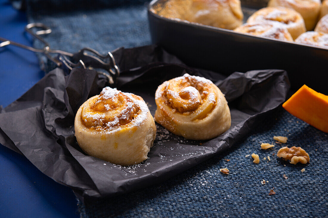 Vegan yeast buns filled with pumpkin pudding and walnuts