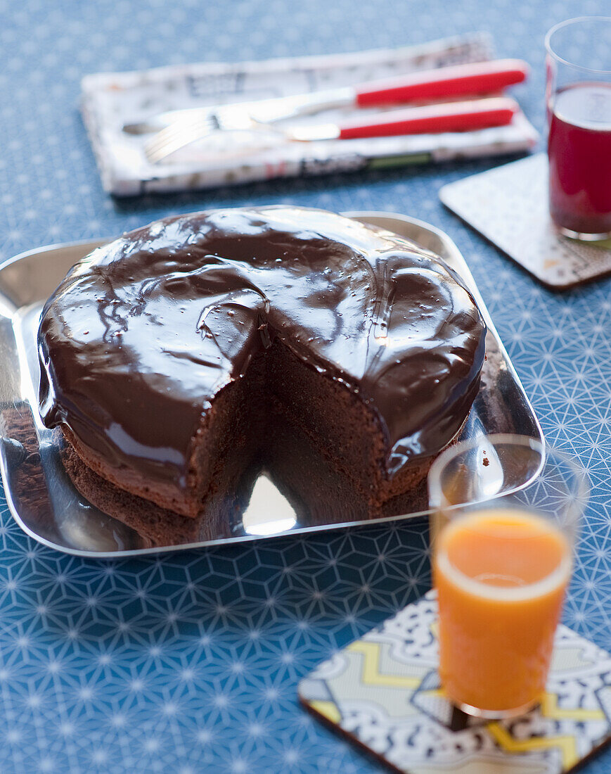 Chocolate cake on a tray, sliced