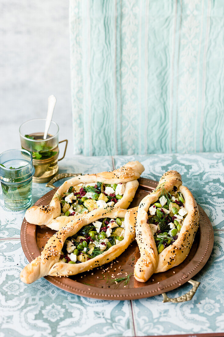Oriental courgette pide with edamame and feta cheese