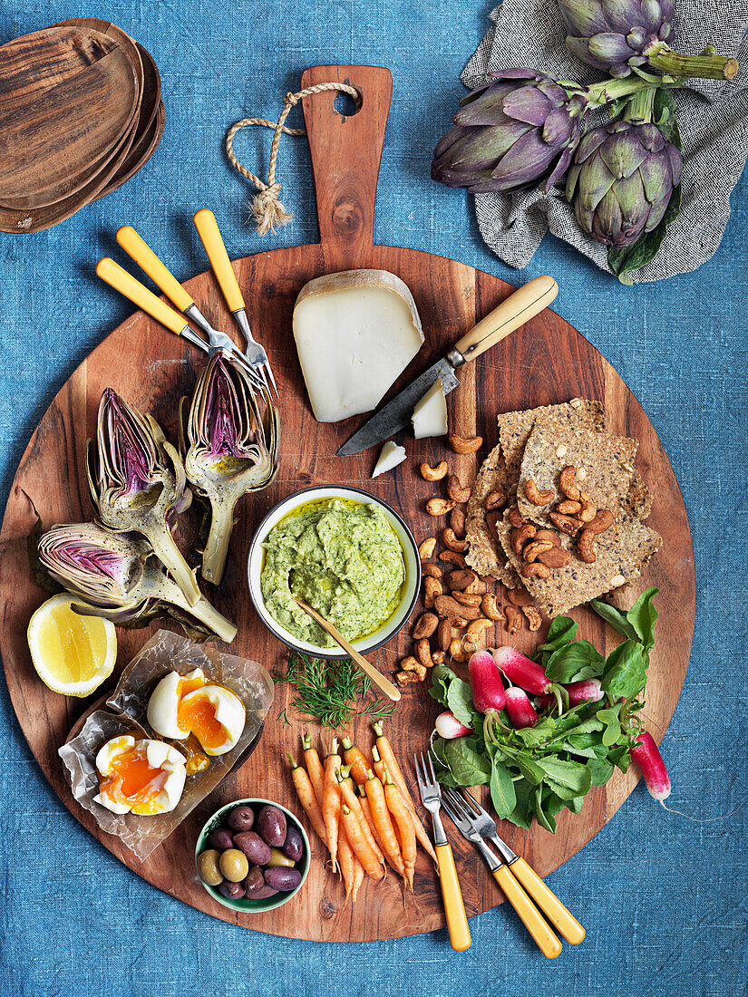 Fresh greens, olives, cheese, artichokes, eggs, radish, nuts, avocadospread