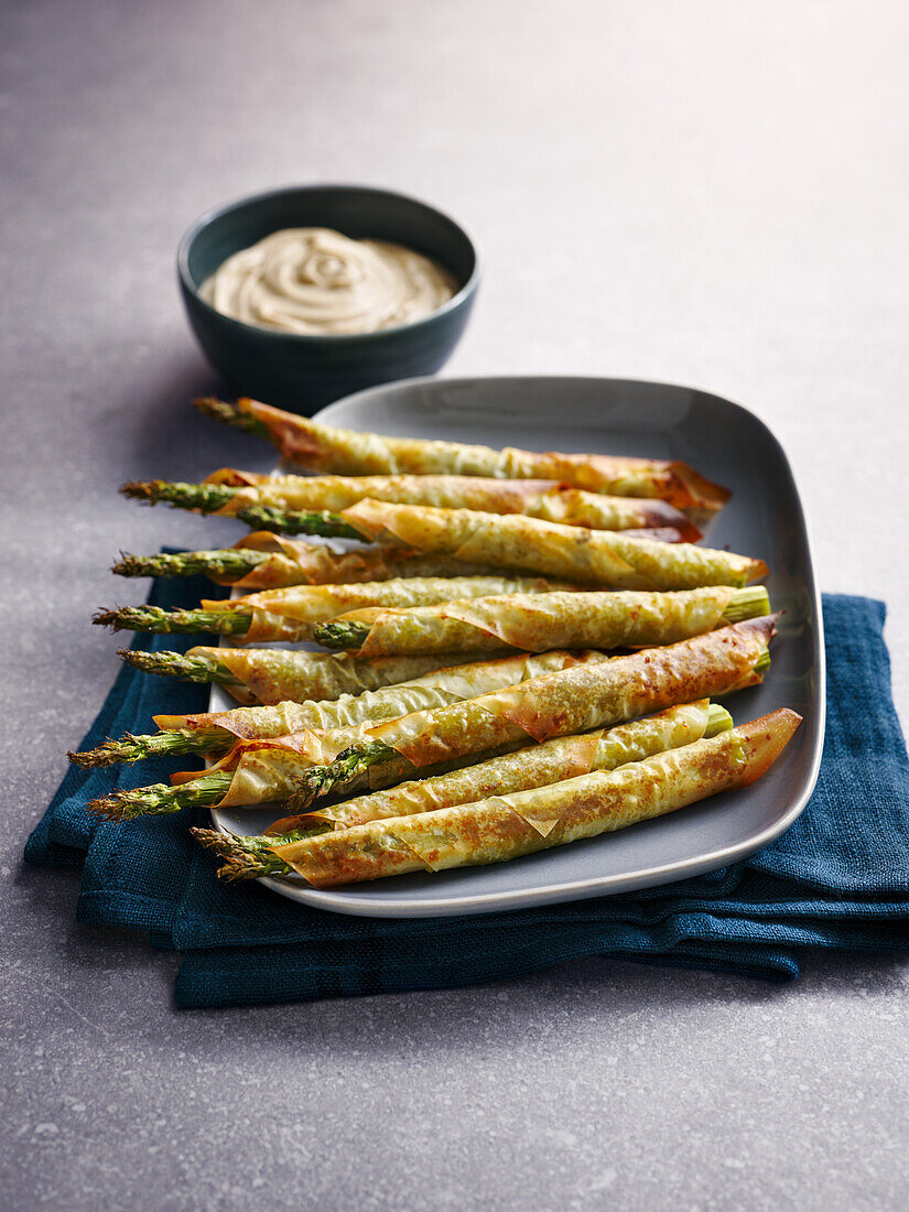Green asparagus spears wrapped in filo pastry