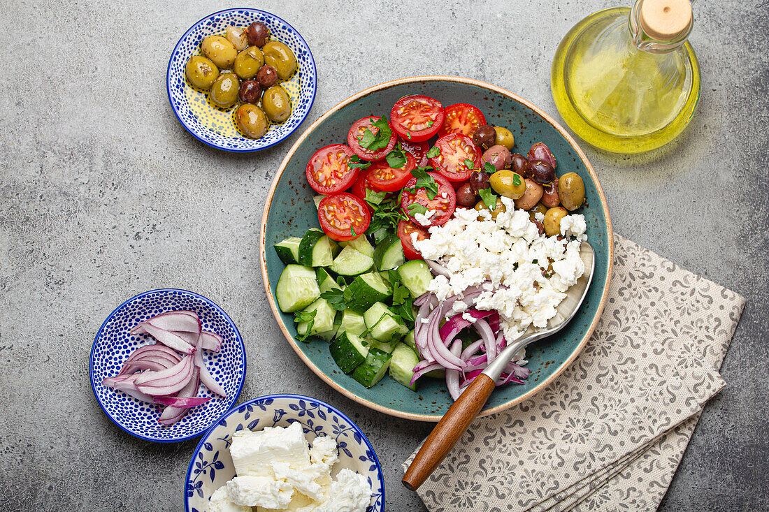 Greek mediterranean salad with tomatoes, feta cheese, cucumber, whole olives and red onion