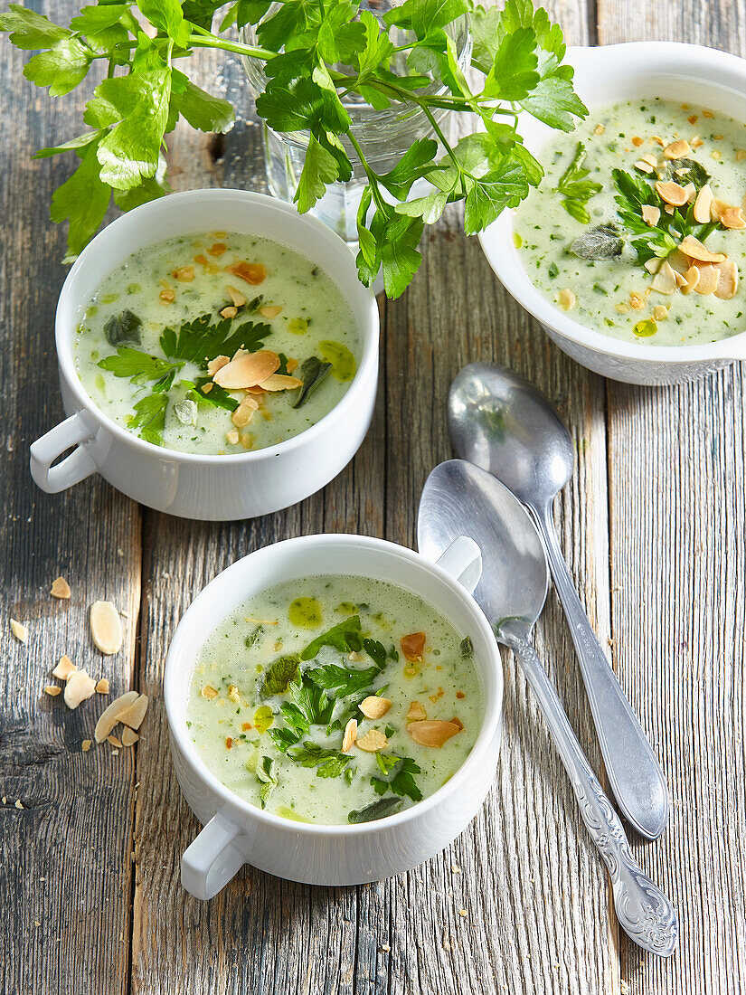 Herb soup with rice and flaked almonds