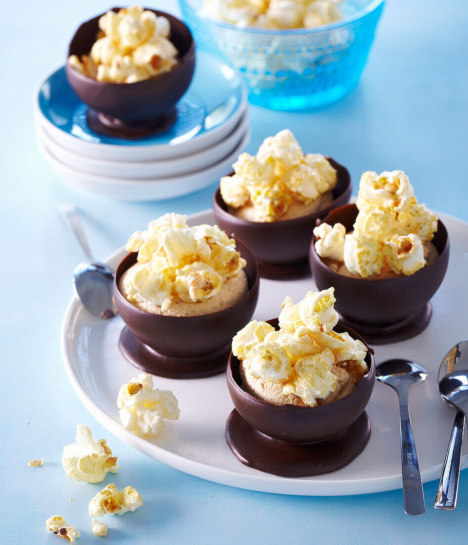 Chocolate bowls with caramel cream and popcorn