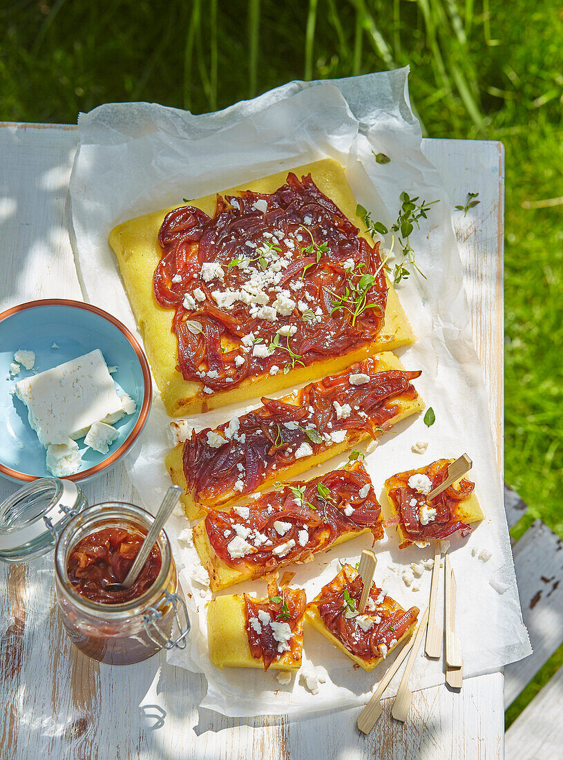 Polenta canapes with onion jam and cheese