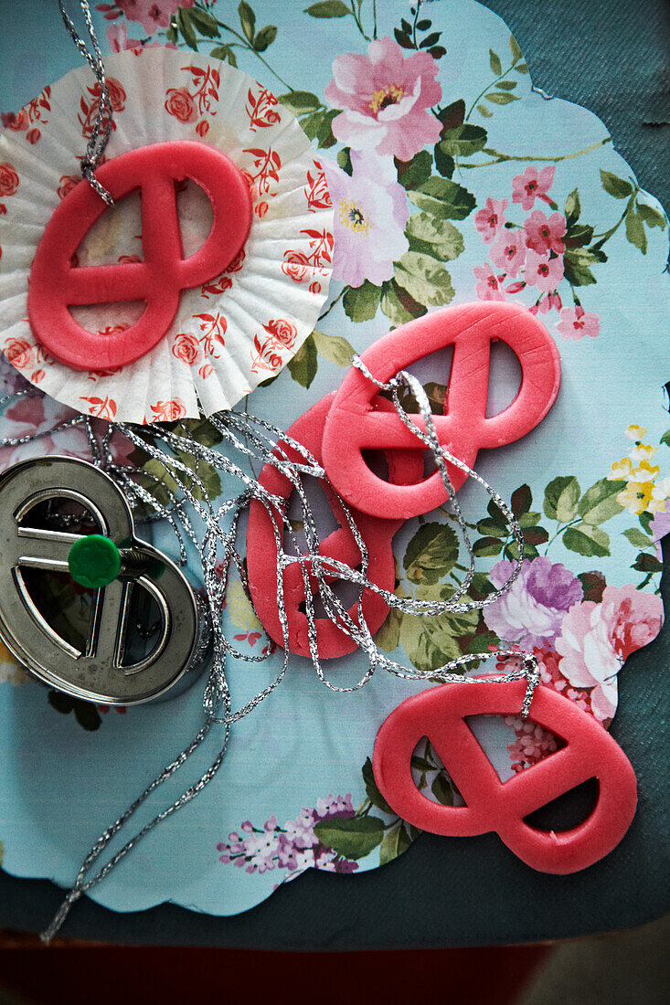 Handmade pendants on a patterned background