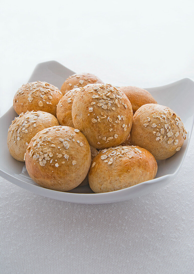 Wholemeal rolls in a bowl