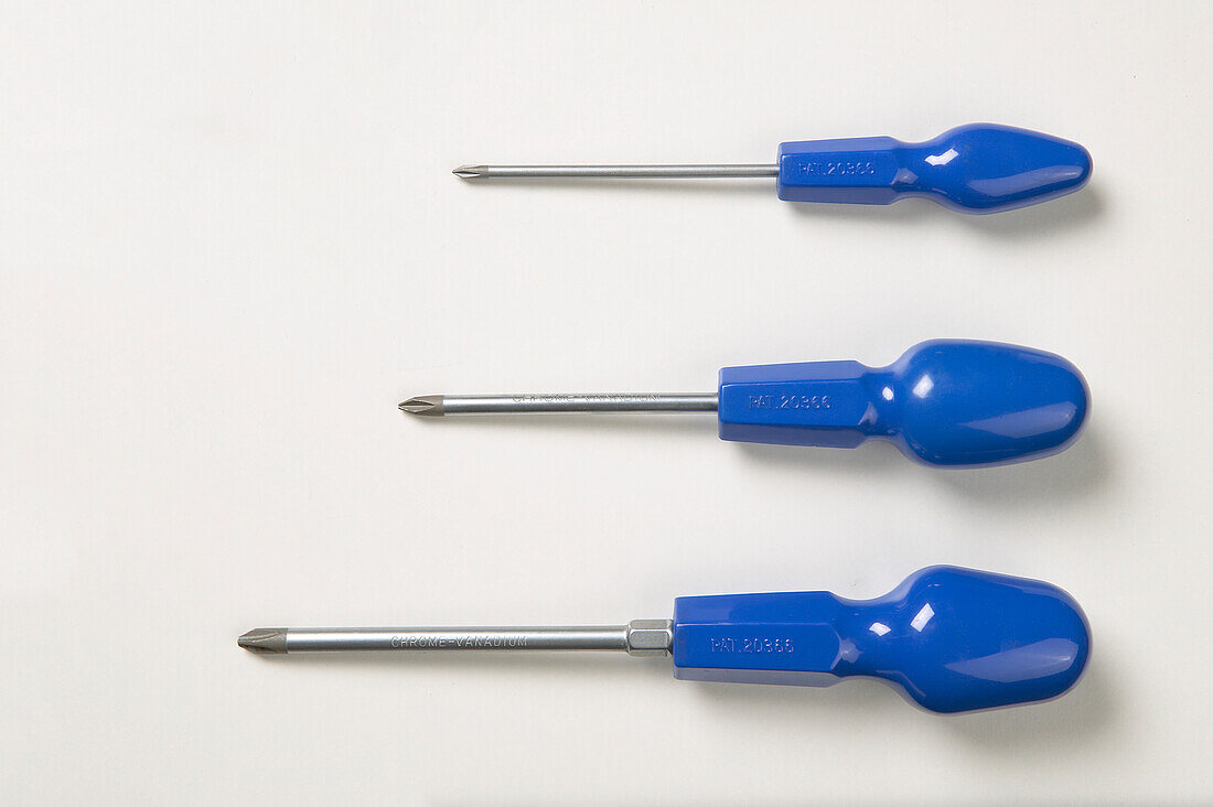 Three blue handled screwdrivers