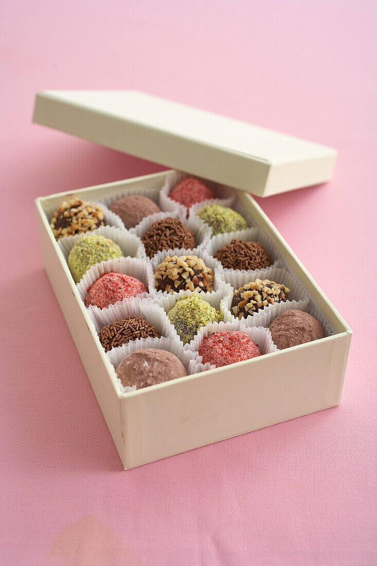 Box of varying topped chocolate truffles