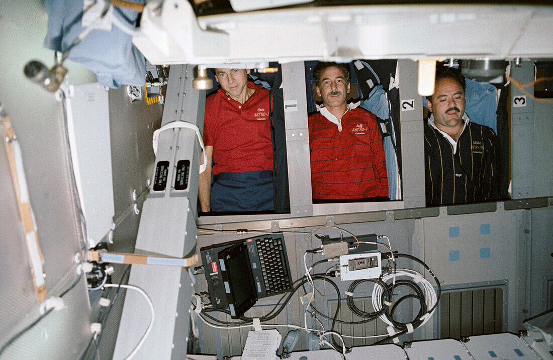 STS-35 crew in sleep quarters in-flight