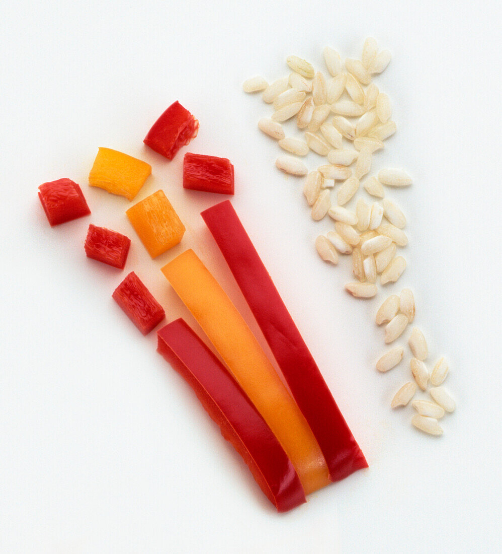 View of three stalks of red and yellow pepper