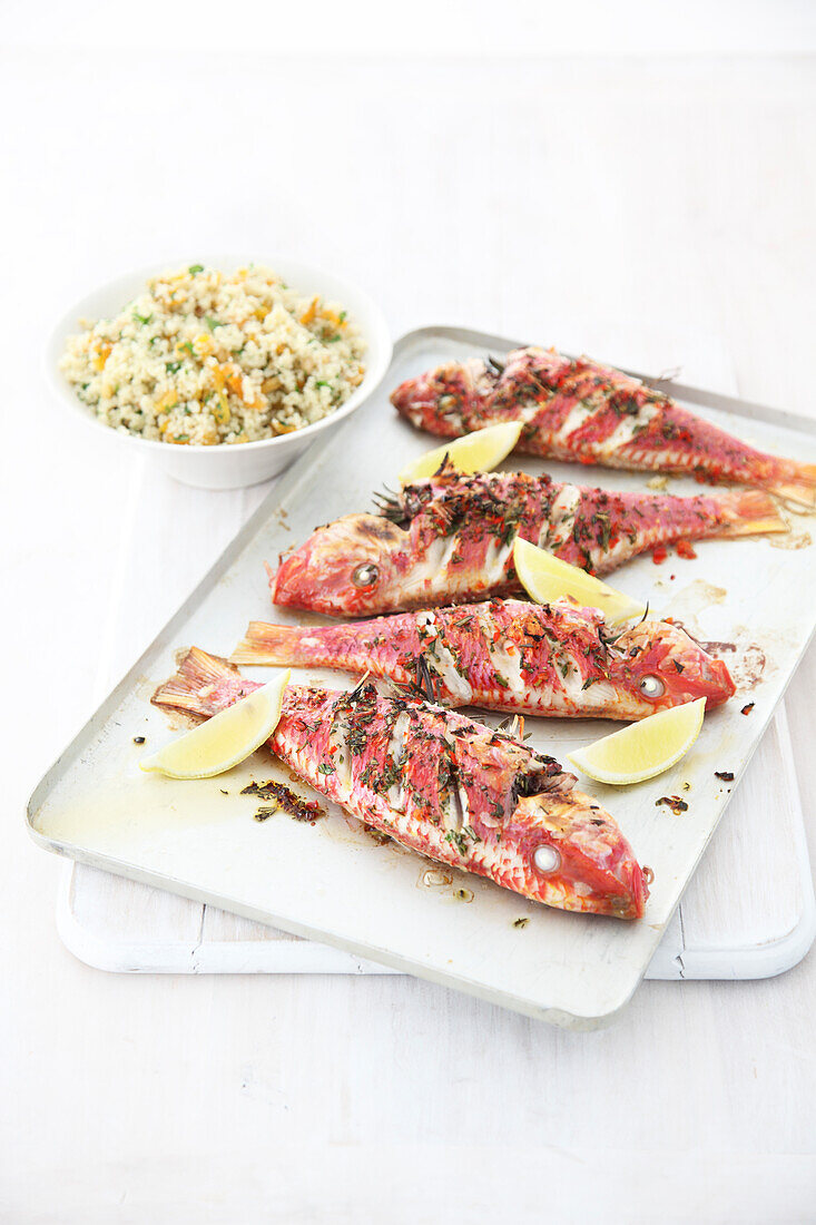 Grilled red mullet, lemon wedges and rice salad