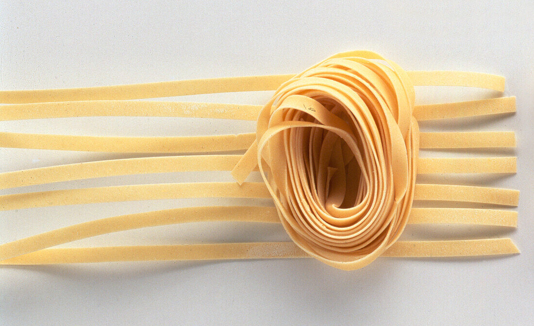 Straight tagliatelle pasta and a tagliatelle nest