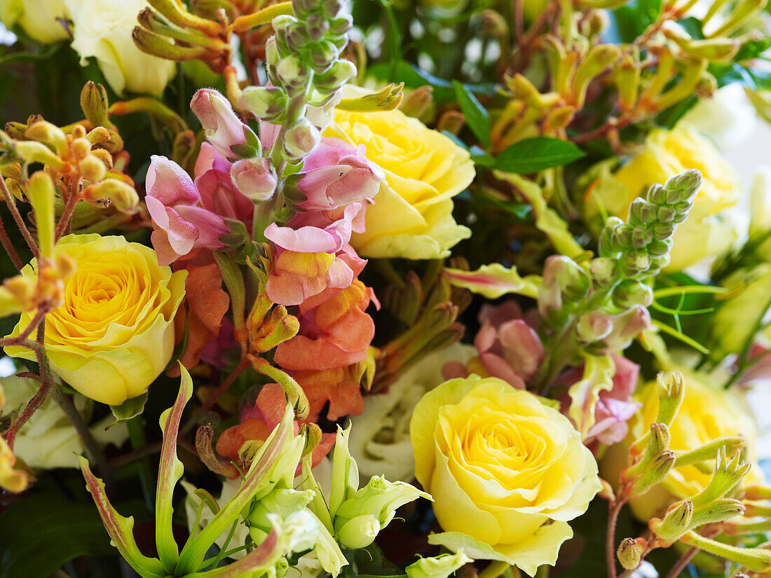 Rose, gloriosa lily, snapdragon flower arrangement
