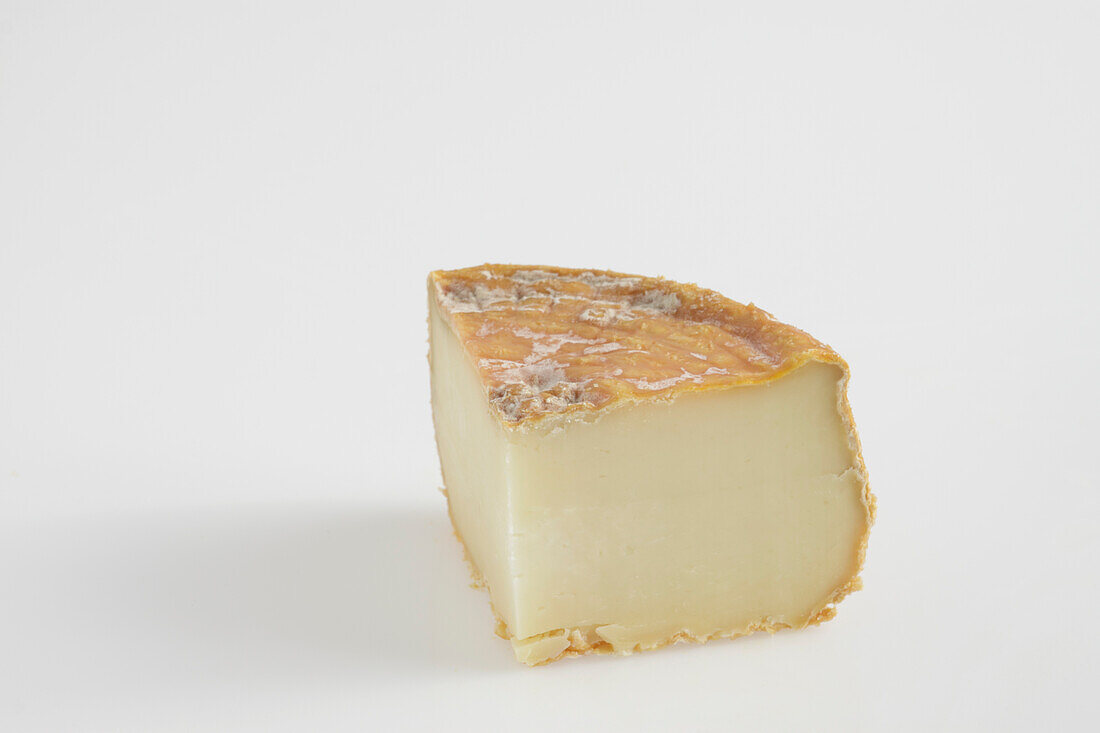 Slice of French U Bel Fiuritu ewe's milk cheese