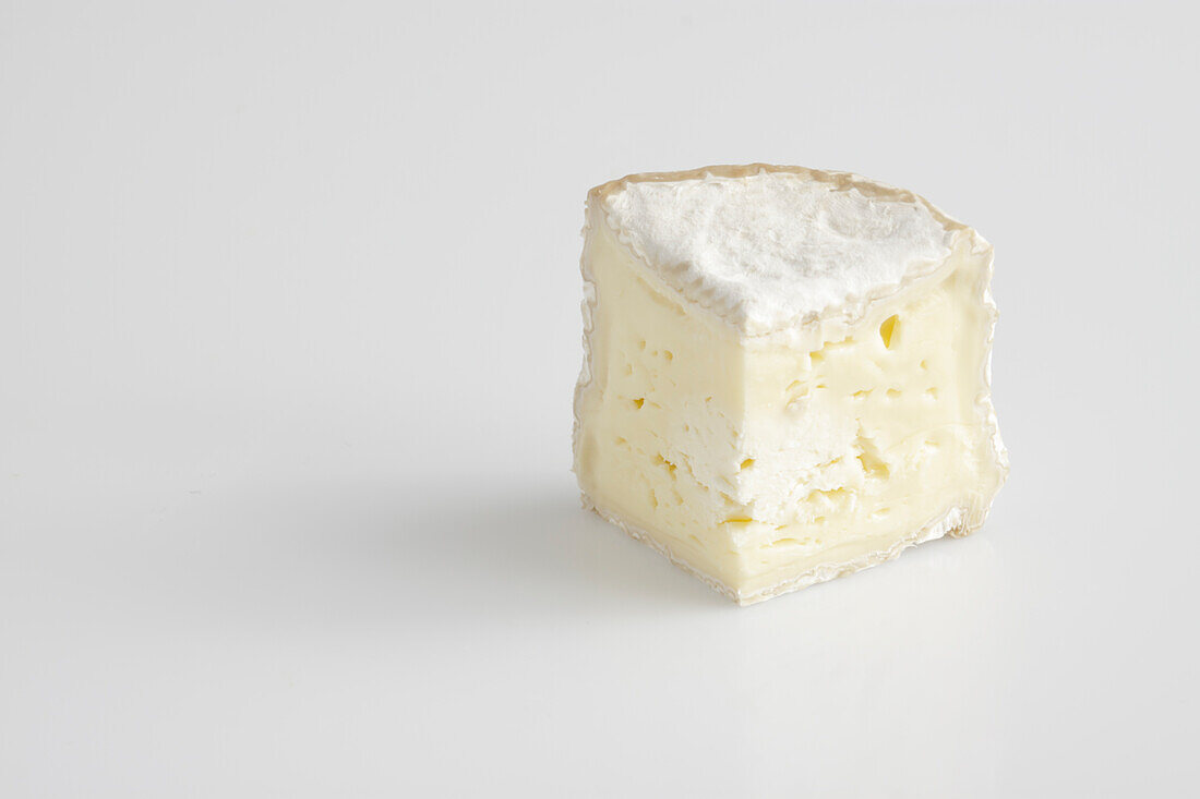 Slice of French chaource AOC cow's milk cheese