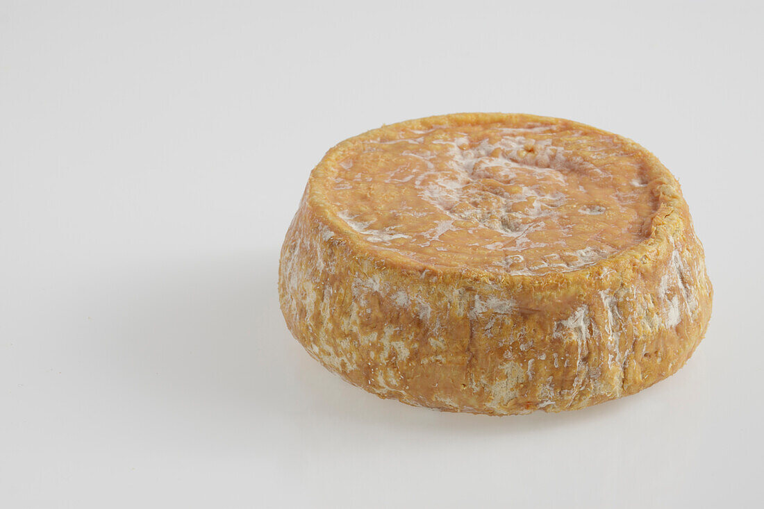 Whole round of French U Bel Fiuritu ewe's milk cheese