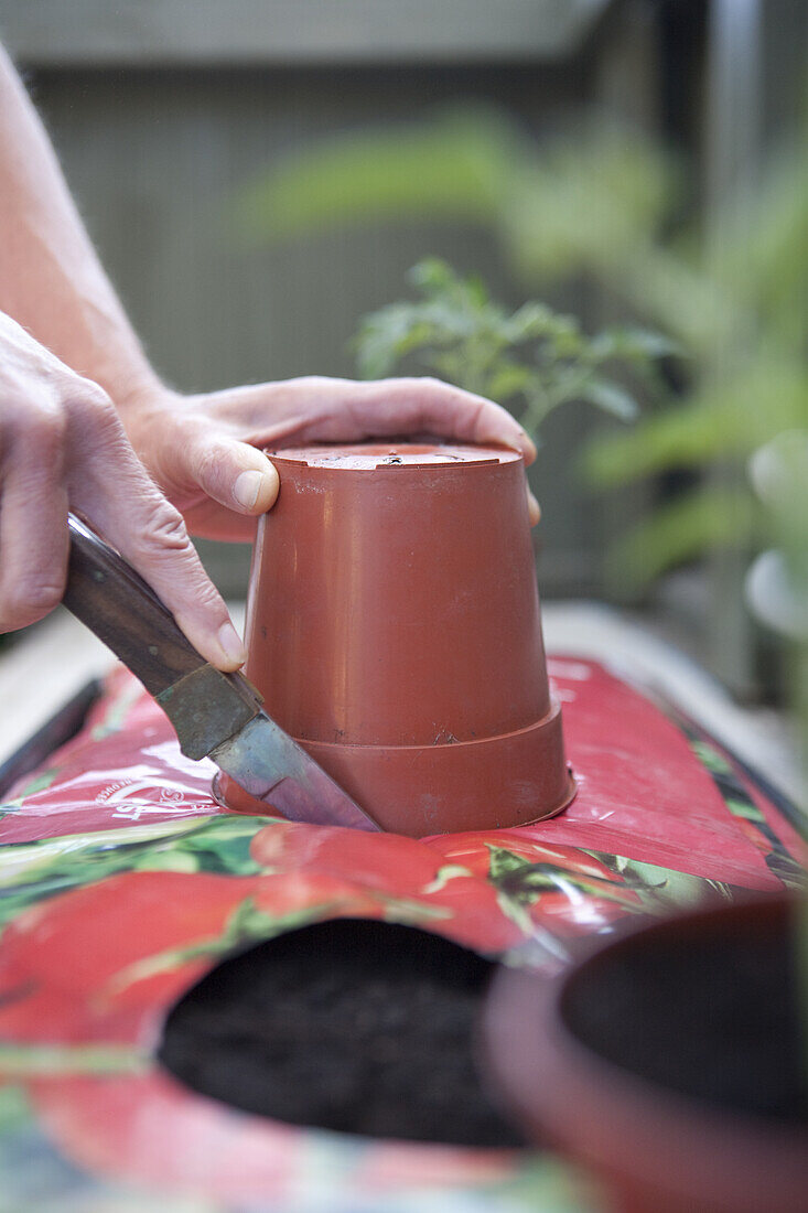 Making planting hole using a garden knife