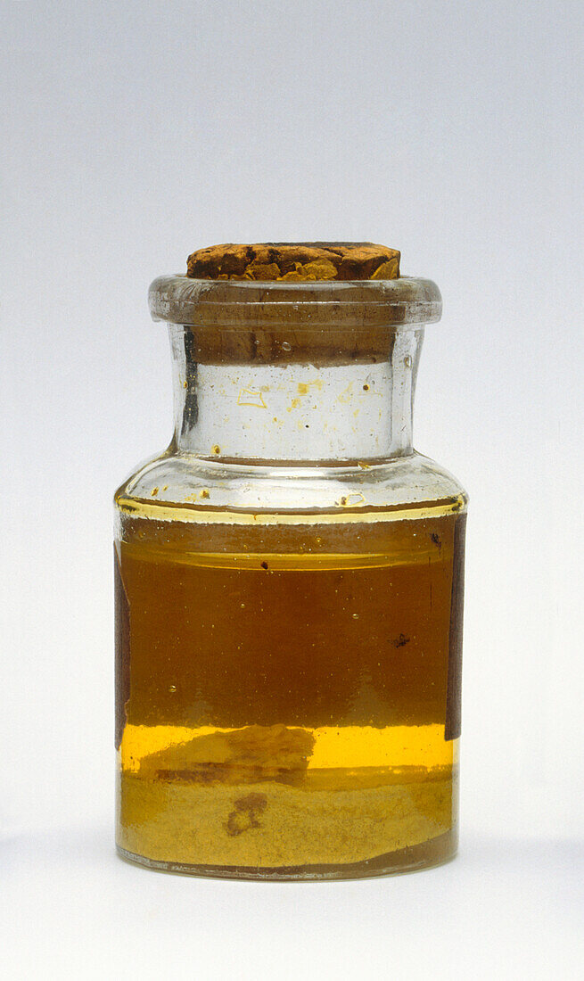 Corked glass jar containing homeopathic medicine
