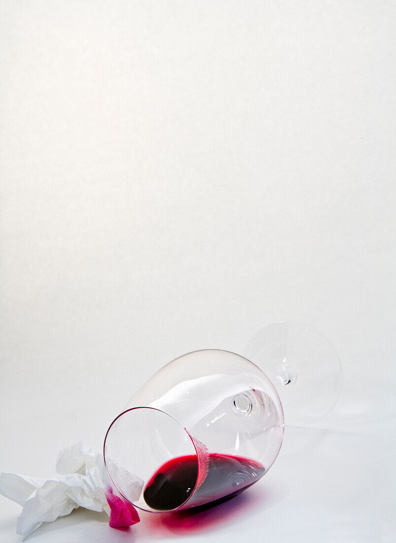 Spilt glass of red wine