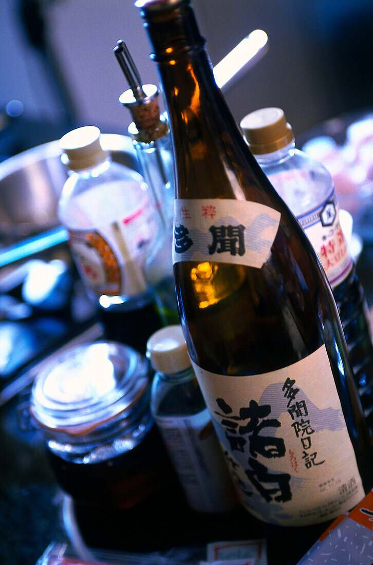 Sushi ingredients including bottle of sake