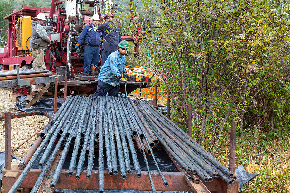Workers plugging abandoned oil well