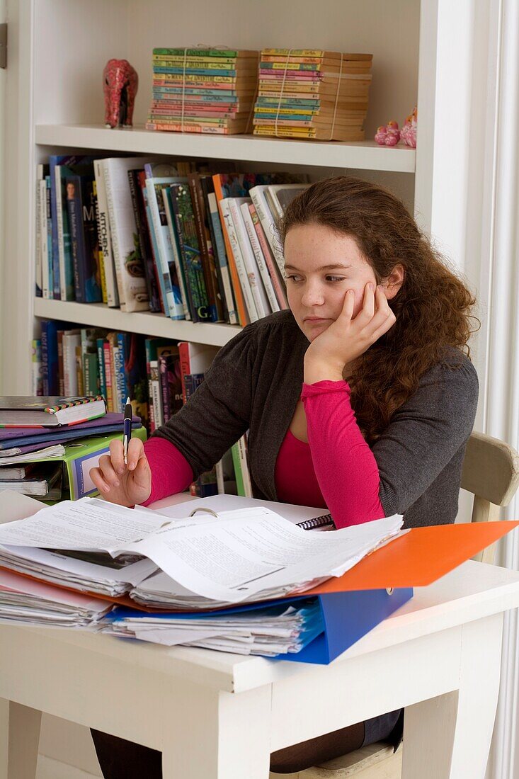 Girl sitting at desk with her homework