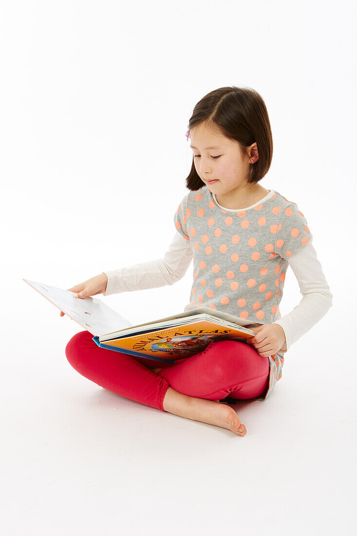 Girl sitting reading a book