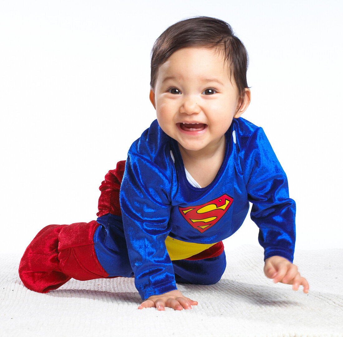 Baby girl wearing Superman suit