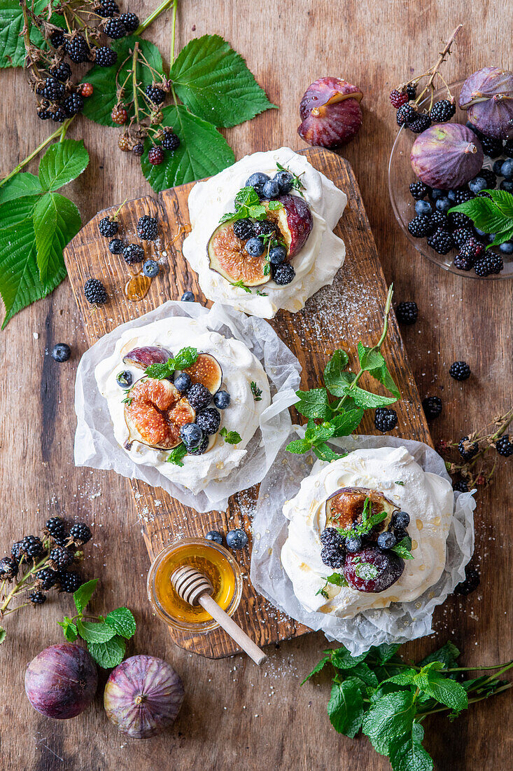 Mini pavlovas with figs, blueberries and blackberries