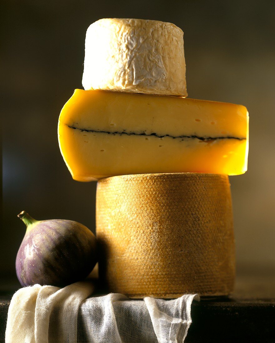 Tower of cheese (three hard cheeses) and a fig