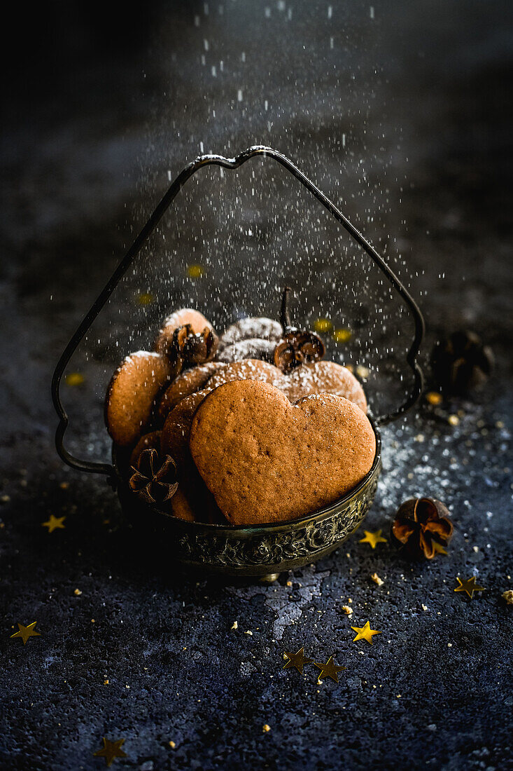 Heart-shaped gingerbread cookies in vintage cups