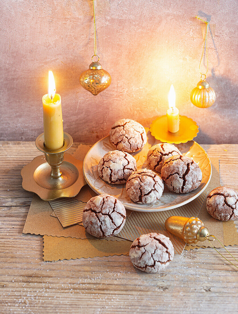 Chocolate snowballs with Christmas decorations and candlelight