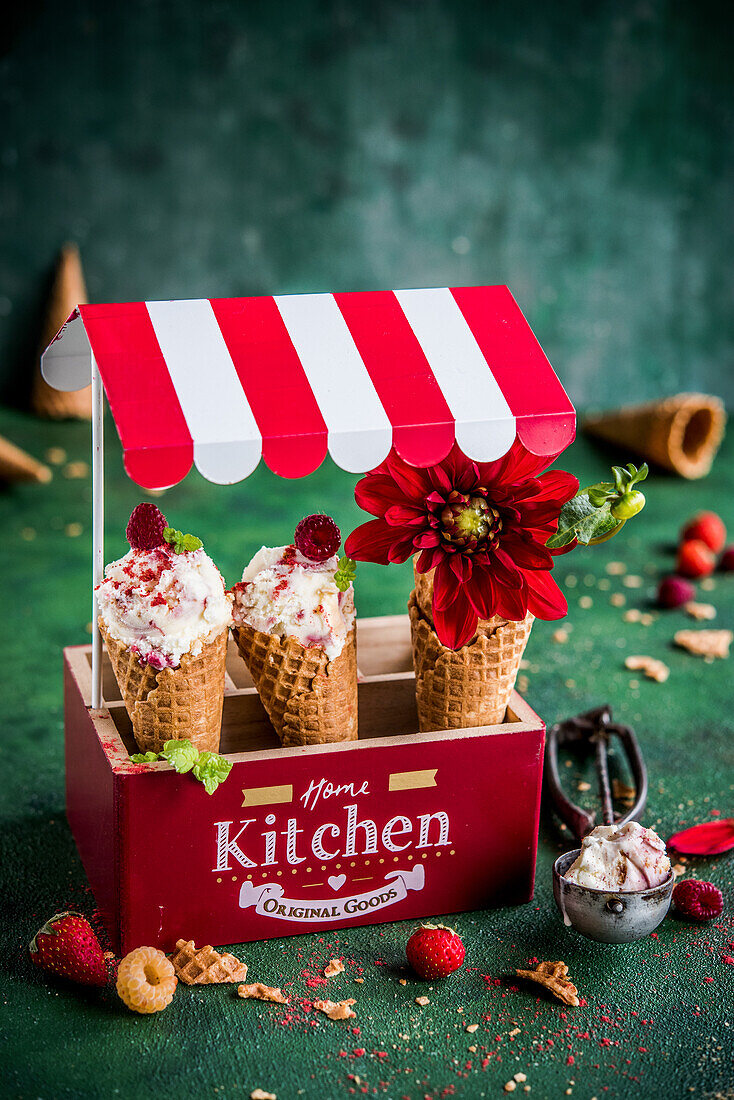 Strawberry and raspberry ice cream in waffle cones