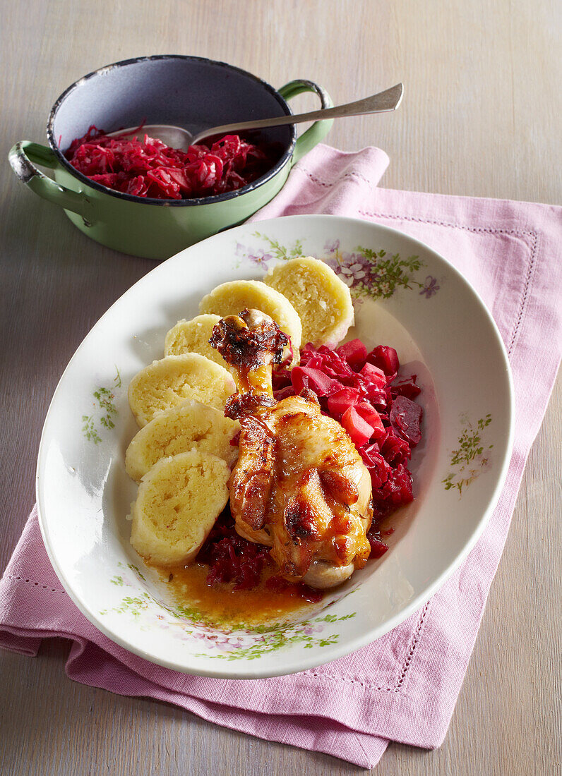 Turkey wings with red cabbage and potato dumplings