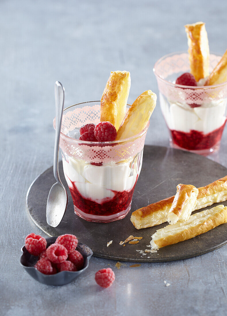 Creamy dessert with white chocolate and raspberries