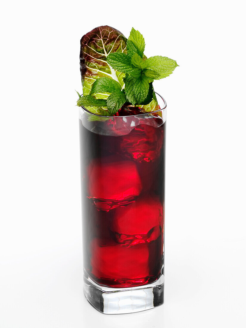 Iced Hibiscus Hemp Tea garnished with fresh mint and red leaf lettuce